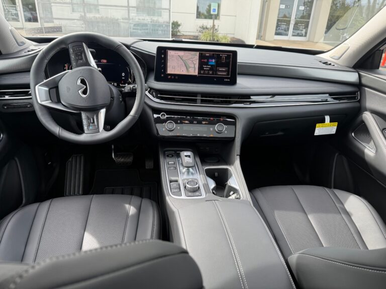 Front seats, 12.3-inch touchscreen and center console of a 2027 INFINITI QX60 Luxe